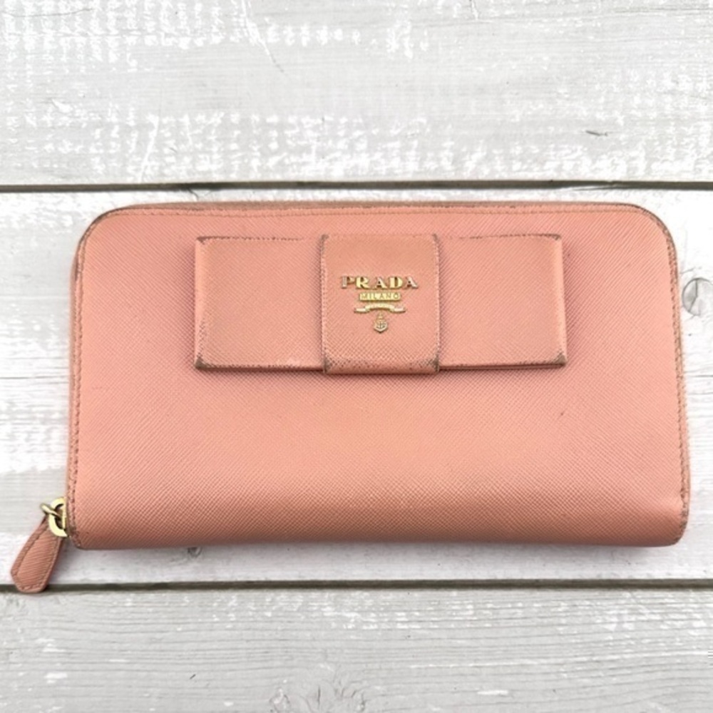 AUTHENTIC Prada Saffiano Fiocco Bow Zip Around Wallet. Previously owned.